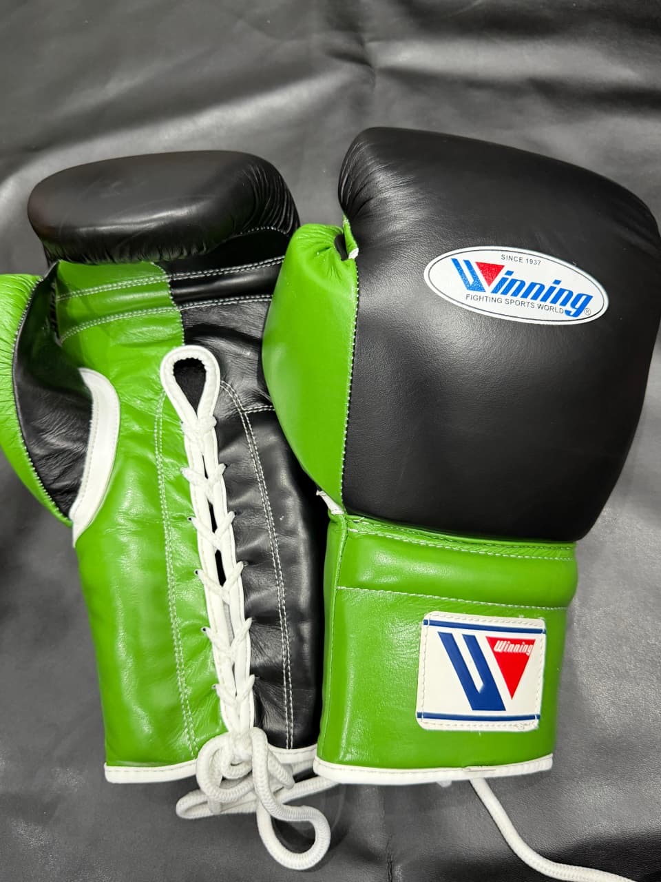 Green and black Winning boxing gloves