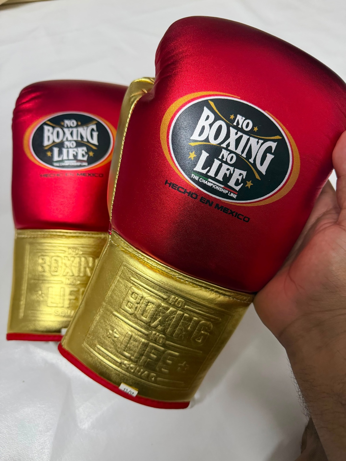 Red and gold No Boxing No Life gloves
